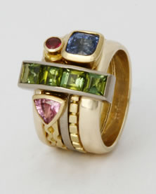 'Stacking Ring' in 18K yellow and white gold with bridge feature set with four Carré cut green Tourmalines